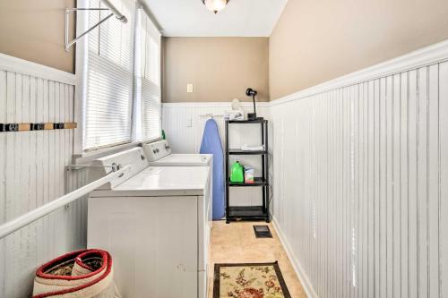 a small kitchen with a sink and a window at Bright Apartment, Near Vicksburg Military Park! in Vicksburg