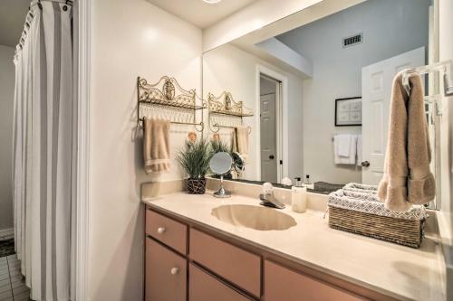 a bathroom with a sink and a mirror at Pet-Friendly Home in Vero Beach, 1 Mi to Beach! in Vero Beach
