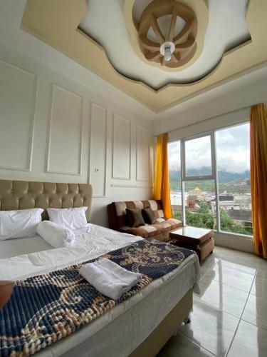Posteľ alebo postele v izbe v ubytovaní Homestay Dieng Adiputra Syariah