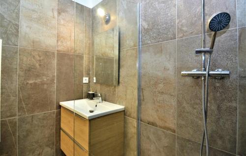 a bathroom with a sink and a shower at Industrial loft centre ville Orange clim wifi in Orange