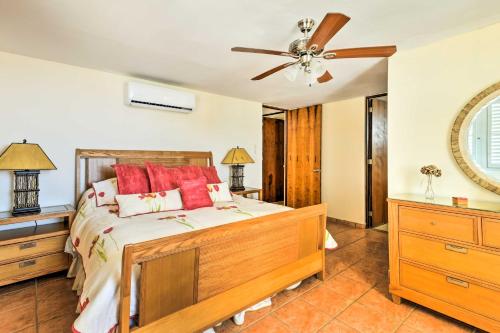 a bedroom with a bed and a ceiling fan at Fajardo Townhouse with Private Pool and Ocean View in Fajardo