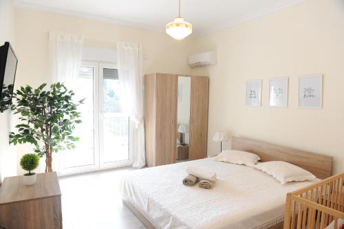 a bedroom with a bed with two speakers on it at Memories... in Iraklitsa