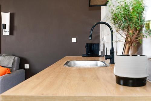 a kitchen counter with a sink in a kitchen at LikeHome Jerusalem in Jerusalem