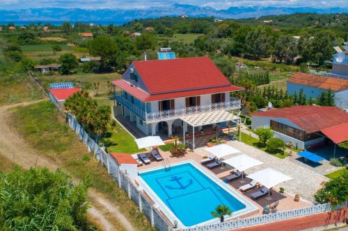 an aerial view of a house with a swimming pool at Villa Paradiso: Near beach, superb pool and garden in Astrakeri