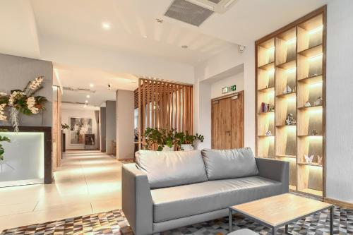 a living room with a couch and a table at Afrodyta Spa in Świnoujście