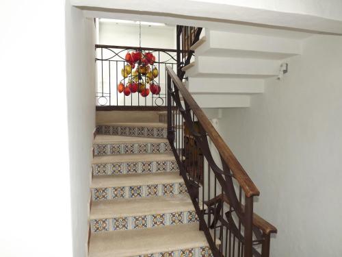 a staircase with a basket of fruit on the rail at Hotel Grand Maria in San Cristóbal de Las Casas