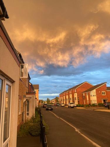 a view of a street with houses and a cloudy sky at sen in Liverpool