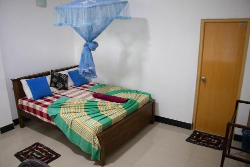 Ένα ή περισσότερα κρεβάτια σε δωμάτιο στο Freedom Home Stay