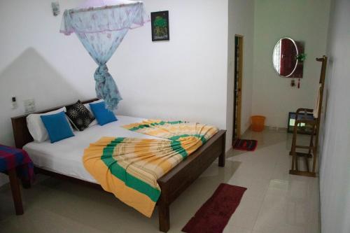 Ένα ή περισσότερα κρεβάτια σε δωμάτιο στο Freedom Home Stay
