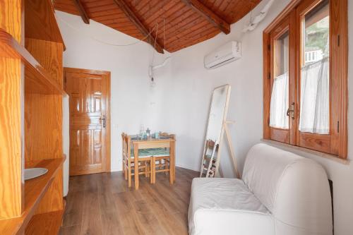 a living room with a white couch and a table at Solemar Sicilia - Residence Mer et Soleil in Bagheria