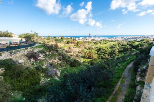 a view of the city from the top of a hill at Beautiful Villa with Breathtaking Views in Swieqi by 360 Estates in Is-Swieqi