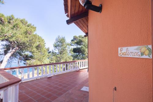 a balcony of a house with a sign on it at Solemar Sicilia - Residence Mer et Soleil in Bagheria