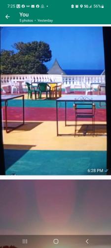 a screenshot of a picture of a park with a bench at Dela de-Rose Guest House Negril Jamaica in Negril