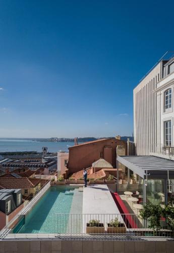 a view of the pool on the roof of a building at Verride Palácio Santa Catarina in Lisbon