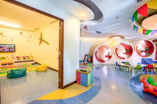 a childrens playroom with a room filled with toys at Courtyard by Marriott Bali Nusa Dua Resort in Nusa Dua