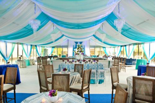 a blue and white tent with tables and chairs at The Westin Boston Seaport District in Boston