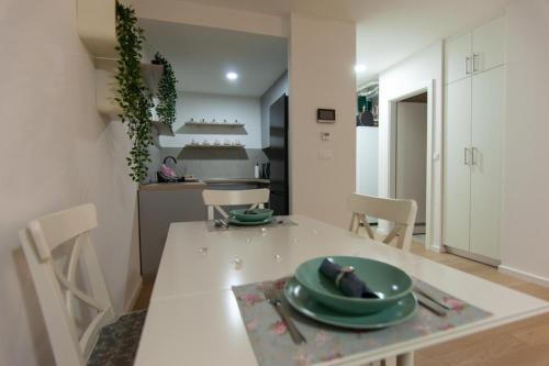 a kitchen with a table with a green plate on it at MM Apartments Zore in Zagreb