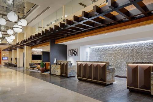 a lobby with a waiting area in a hospital at Dallas/Plano Marriott at Legacy Town Center in Plano