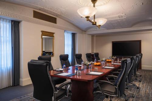 a conference room with a long table and chairs at Marriott St. Louis Grand in Saint Louis