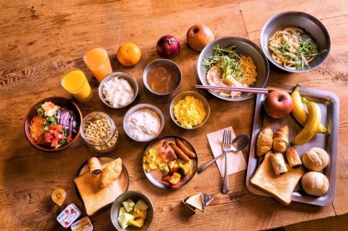 a table with many different dishes of food on it at MOXY Osaka Honmachi in Osaka