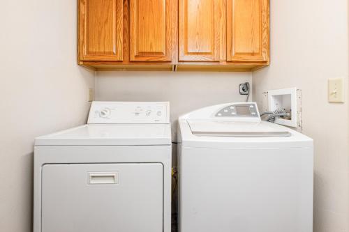 a white washer and dryer in a small kitchen at Snowbird Chalet #5 in Girdwood