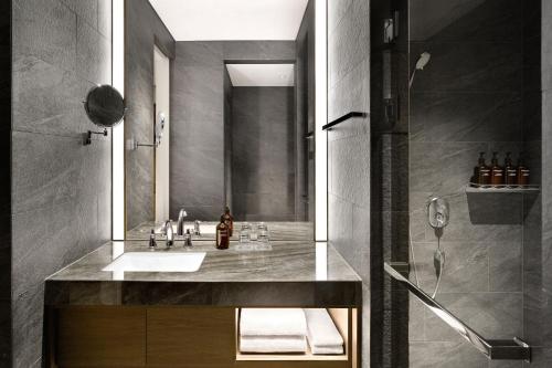 a bathroom with a sink and a shower at Hotel Onoma Daejeon, Autograph Collection in Daejeon