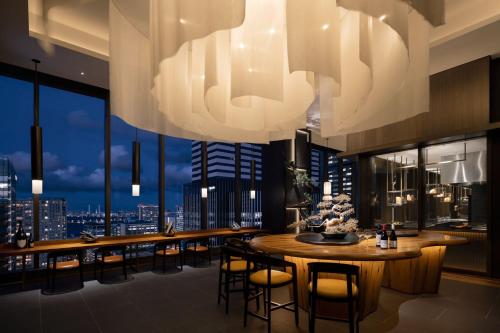 a dining room with a view of the city at The Westin Yokohama in Yokohama