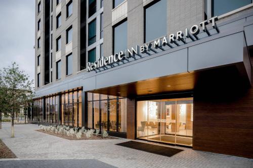 a store front of a building with a sign on it at Residence Inn by Marriott Dallas Frisco in Frisco