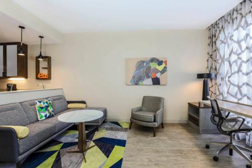 a living room with a couch and a chair at Residence Inn by Marriott Dallas Frisco in Frisco