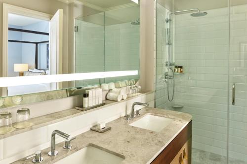 a bathroom with a sink and a shower at Palace Hotel, a Luxury Collection Hotel, San Francisco in San Francisco