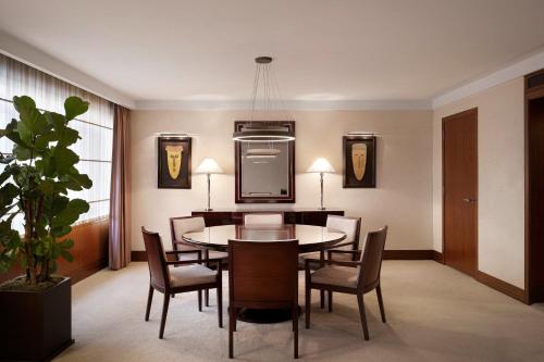 a dining room with a table and chairs at Westin Josun Seoul Hotel in Seoul