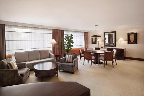 a living room with a couch and a table at Westin Josun Seoul Hotel in Seoul