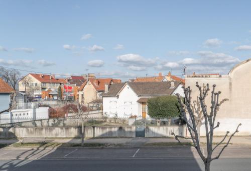 a view of a city with houses and a street at La Grande Maison Gannat in Gannat