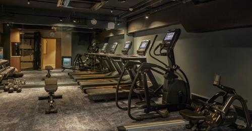 a row of tread machines in a gym at Hotel Indigo - Exeter by IHG in Exeter