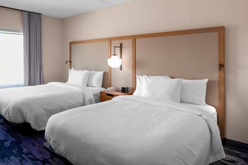 a hotel room with two beds and a window at Fairfield by Marriott Inn & Suites Somerset in Somerset