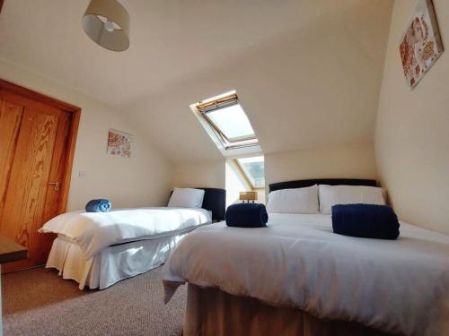 a bedroom with two beds and a window at Private accommodation in house close to Galway City in Galway