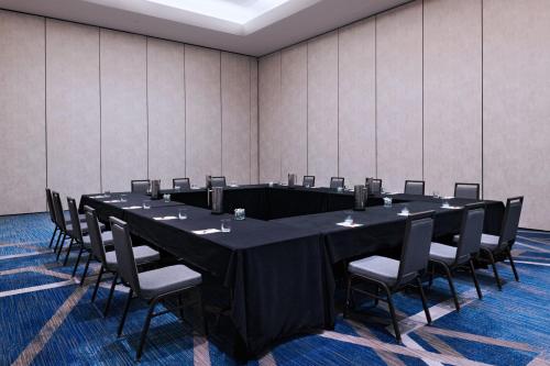 a conference room with a long table and chairs at The Woodlands Waterway Marriott Hotel and Convention Center in The Woodlands