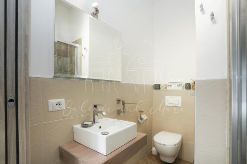 a bathroom with a sink and a toilet at Balconi sul mare in Otranto