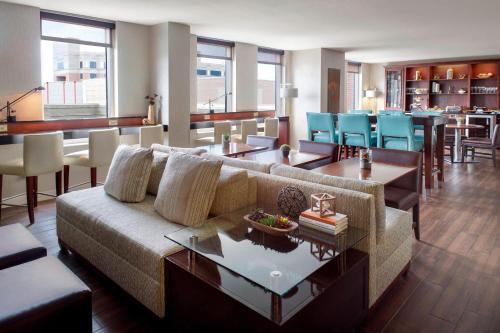 a living room with a couch and a table at Augusta Marriott at the Convention Center in Augusta