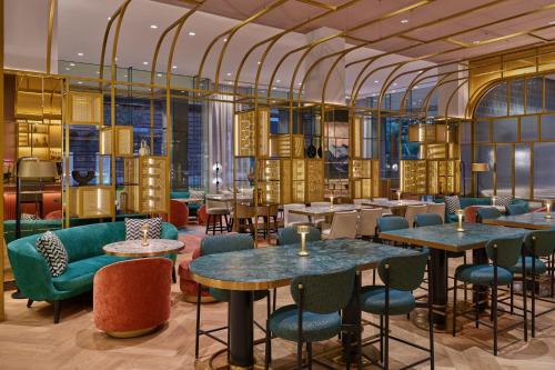 a dining room with tables and chairs and tablesktop at The St. Regis San Francisco in San Francisco