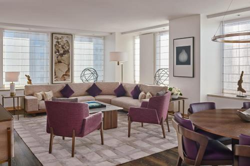 a living room with a couch and a table at The St. Regis San Francisco in San Francisco
