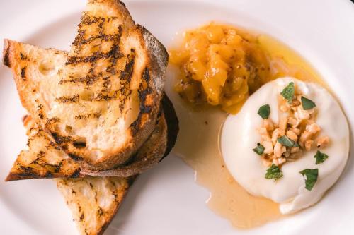 a plate of food with a hard boiled egg and toast at AC Hotel by Marriott Austin-University in Austin