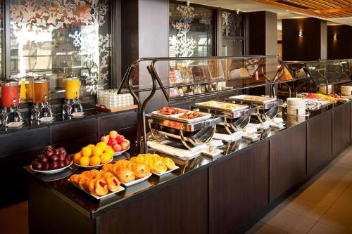 a buffet line with many different types of food at Niagara Falls Marriott on the Falls in Niagara Falls