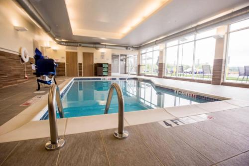 a pool in a building with a person standing next to it at Fairfield Inn & Suites by Marriott Philadelphia Broomall/Newtown Square in Broomall