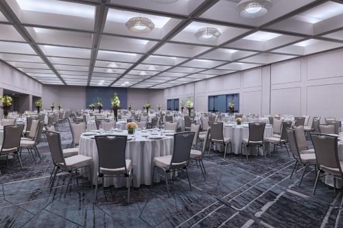 a banquet hall with tables and chairs in a room at Dallas Marriott Downtown in Dallas