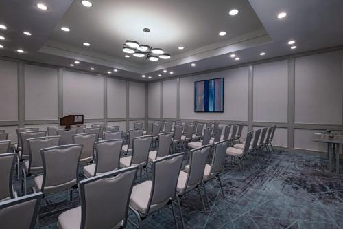 a room with rows of chairs and a podium at Dallas Marriott Downtown in Dallas