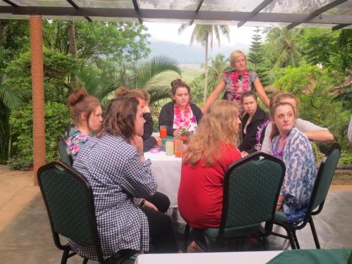 a group of women sitting at a table at Oruthota Chalets in Kandy