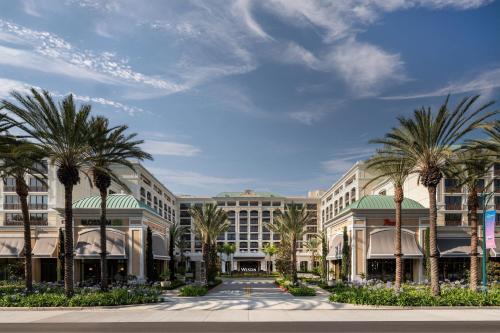 a rendering of the exterior of a resort with palm trees at The Westin Anaheim Resort in Anaheim