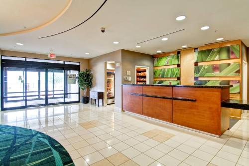 a lobby with a reception desk in a building at SpringHill Suites Erie in Erie