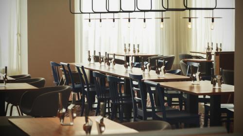 a row of tables and chairs in a restaurant at The Place Tainan in Tainan